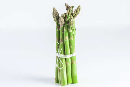 Sheaf of asparagus on a white background isolated