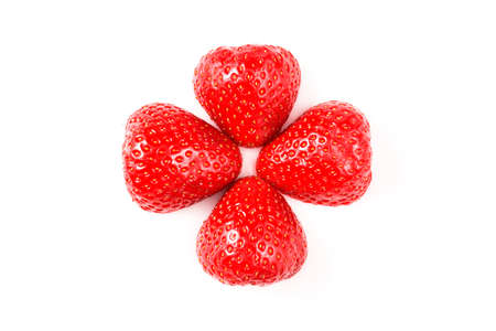 Two red fresh washed strawberries isolated on white background. Close up macro photo. Cut in half.の写真素材