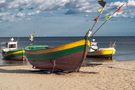 Three fisherman boats at sunny day on the beachの写真素材