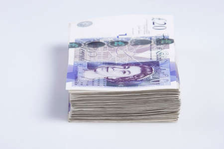 Warsaw, Poland - July 1, 2017: British currency. Pile of British 20 Pound banknotesのeditorial素材