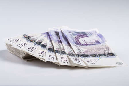 Warsaw, Poland - July 1, 2017: British currency. Fan of British 20 Pound banknotesのeditorial素材