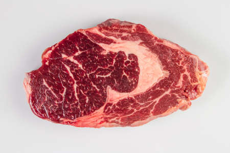 Ripened seasoned beef rib eye or entrecote steak on white background isolated.Top view.の写真素材