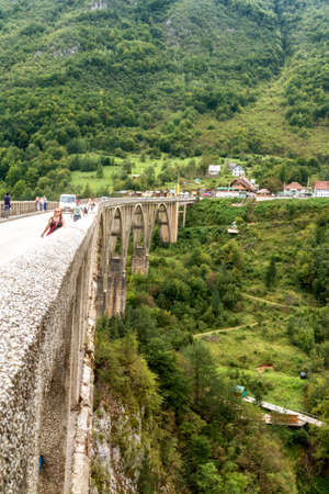 Zabljak/Montenegro - September 2018: People at Tara Bridge. Tara Canyon. "Durdevica Tara Bridge" - concrete Tara Bridge in north Montenegro.のeditorial素材