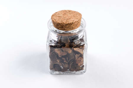 truffle in a glass jar isolated on white background