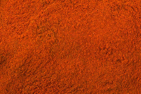 milled or ground paprika or red pepper background. Natural seasoning texture. Natural spices and food ingredients.の写真素材