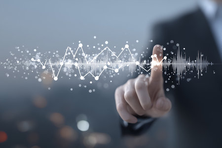 A suited individual touches a glowing digital graph with waveforms and data points, symbolizing innovation and analytics.の素材