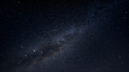 Stellar density and galactic arc evoke clarity, ritual, and editorial depth in cosmic storytelling. Dust shimmer and dark voids highlight contrast, scale, and celestial rhythm.の素材