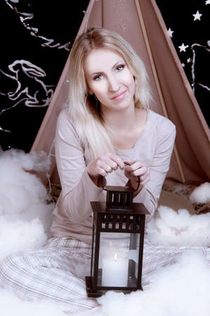 Girl in pajamas with a lanternの写真素材