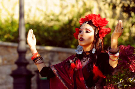 Indian woman with dramatic  makeup dressed in red sariの写真素材