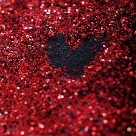 Red glitter and sparkles for valentine's day with bokehの写真素材