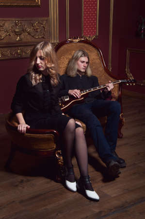 Handsome young couple of musitians boyfriend and girlfriend with blond hairの写真素材