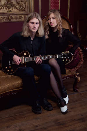 Handsome young couple of musicians boyfriend and girlfriend with blond hairの写真素材