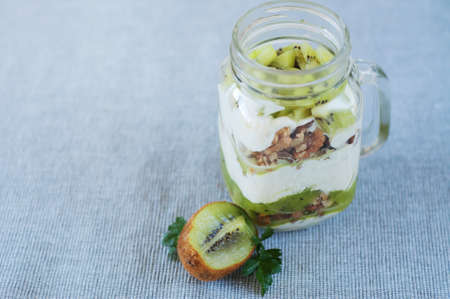 Healthy kiwi meal with nuts, yogurt and granolaの写真素材