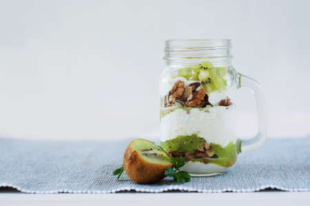 Healthy kiwi meal with nuts, yogurt and granolaの写真素材