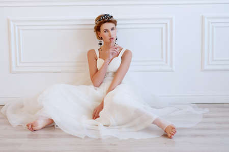 Beautiful royal bride wearing gorgeous dark blue beaded headpiece and earringsの写真素材