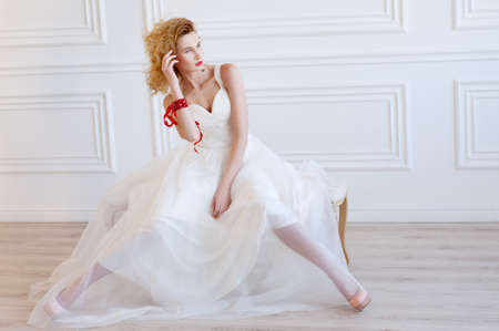 Beautiful blond bride with provocative red lipsの写真素材