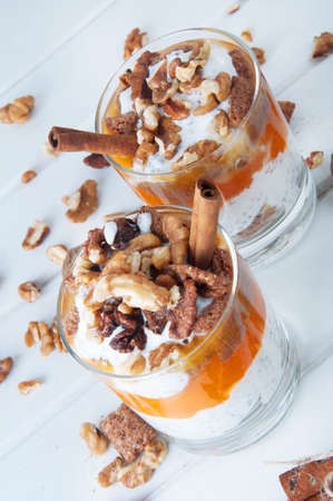 Chia seeds creamy pumpkin spicy pudding with cinnamon and walnuts. Healthy vegetarian seasonal meal.の写真素材