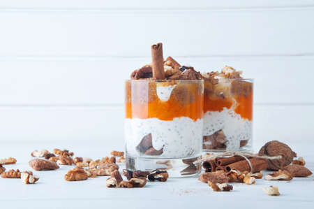 Chia seeds creamy pumpkin spicy pudding with cinnamon and walnuts. Healthy vegetarian seasonal meal.の写真素材