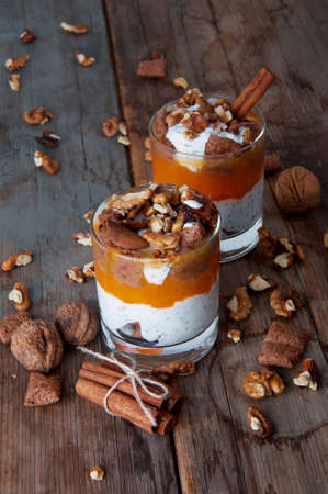Chia seeds creamy pumpkin spicy pudding with cinnamon and walnuts. Healthy vegetarian seasonal meal.の写真素材