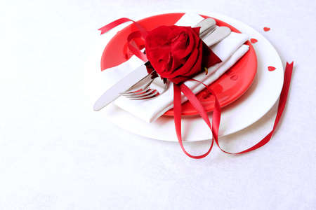 Red and white table setting for diner anniversary celebration on Valentine's Dayの写真素材
