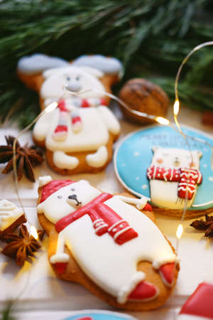 Gingerbread cookies with multicolored frosting decorated for Christmas and New Year holidaysの写真素材