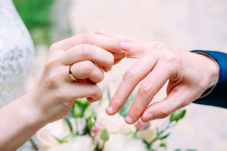 Wedding symbols and accessories. Bridal bouquet and wedding rings.の写真素材