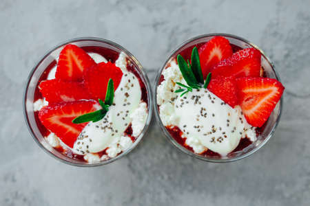 Sweet strawberry summer chia pudding dessert with cream and jellyの写真素材