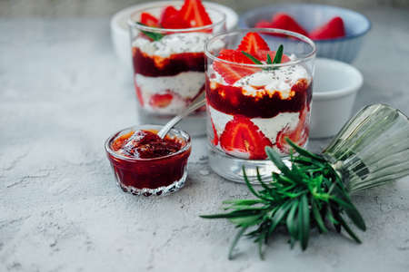 Sweet strawberry summer chia pudding dessert with cream and jelly. Breakfast concept.の写真素材
