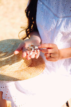 Engagement party. Woman holding wedding ring in her hands.の写真素材