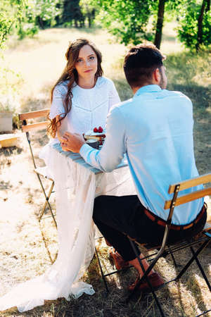 Couple of lovers on a date celebrating their engagement at the dinner table outdoors - Italian restaurant terasseの写真素材