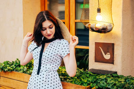 City walk. Romantic young woman strolling on the streets.の写真素材