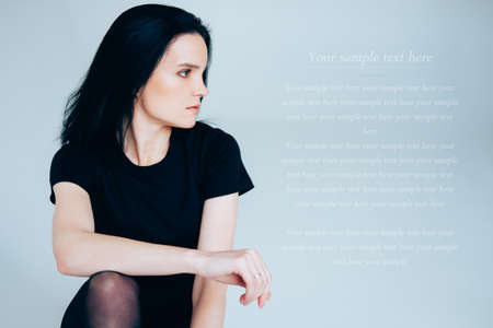 Young adult woman posing wearing total black. Casual outfit.の写真素材