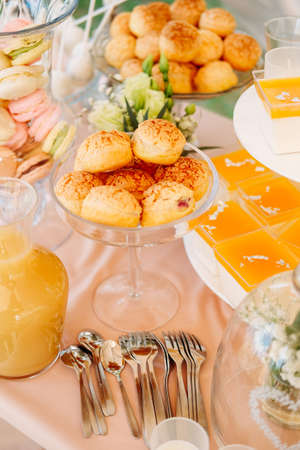 Sweet treats and desserts served on an outdoor table. Candy bar concept.の写真素材