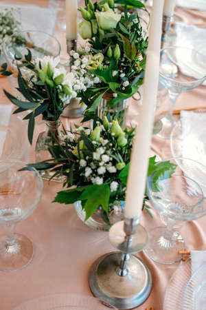 Festive table setting for the wedding venue. Peach summer decoration.の写真素材