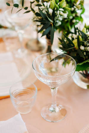 Festive table setting for the wedding venue. Peach summer decoration.の写真素材