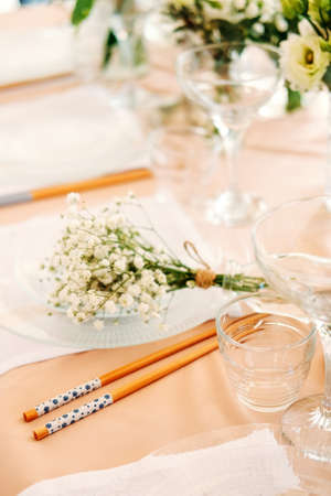 Festive table setting for the wedding venue. Peach summer decoration.の写真素材