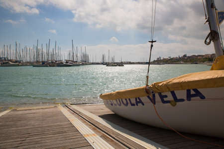 A boat on a slide ready to sail at the port of Marina di Ragusa, Sicilyの写真素材