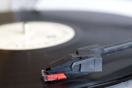 Vinyl record spinning on turntable close upの写真素材