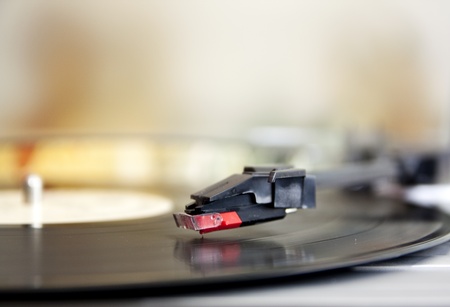 Vinyl record spinning on turntable close up