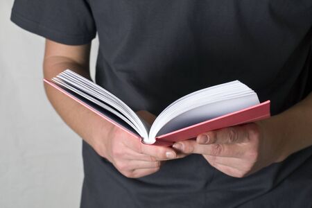 man reading a book  on white backgroundの写真素材