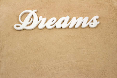 The sandy beach is the writing Dreams from wood の写真素材