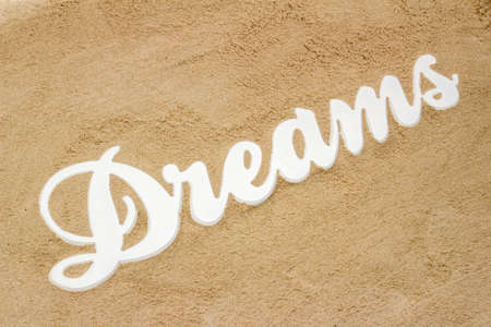 The sandy beach is the writing Dreams from wood の写真素材