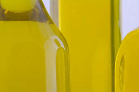 isolated bottle of oil over white backgroundの写真素材