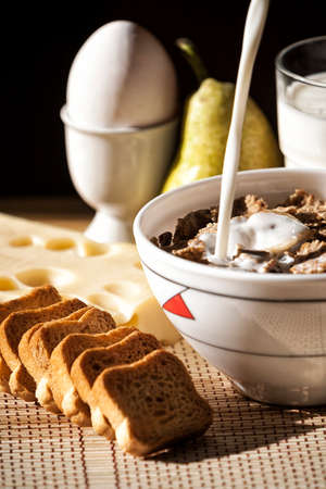 Breakfast with bread, cereals and milk