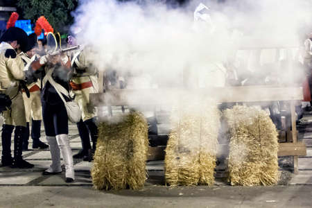 French soldiers firing from a barricade during the Representation of the Battle of Bailen, Bailen, ...