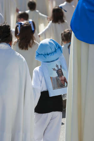 Boy dressed in costalero during a procession of holy week, Andalucia, Spainの写真素材