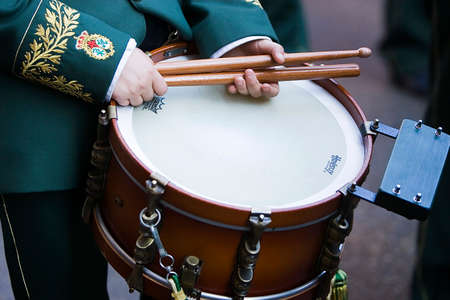 Boy holding drumsticks on a drum during procession during Holy week, Spainのeditorial素材