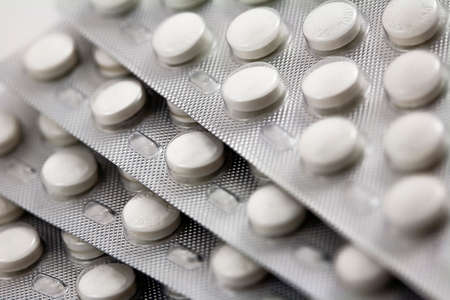 Packaged Pills in aluminium blisters stacked on each otherの写真素材