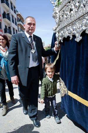 Auxiliary throne or called contraguia accompanied by his son in a procession of holy week, Spainのeditorial素材