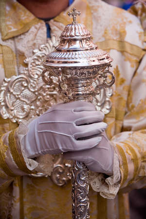 Dalmatic or white robe in a liturgical act of Holy Week, sceptre of silver, Spain